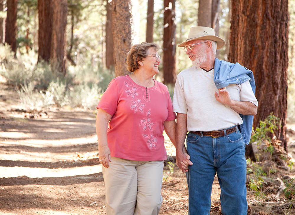 Loving Senior Couple Walking and Enjoying the Outdoors Together.